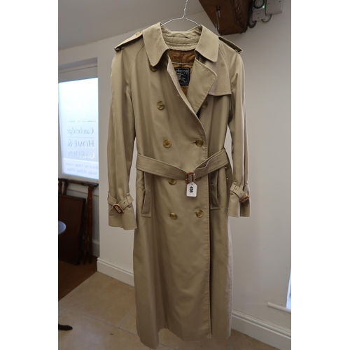 456 - A lady's Burberry double breasted rain or trench coat, size 12, complete with liner and scarf, and a... 