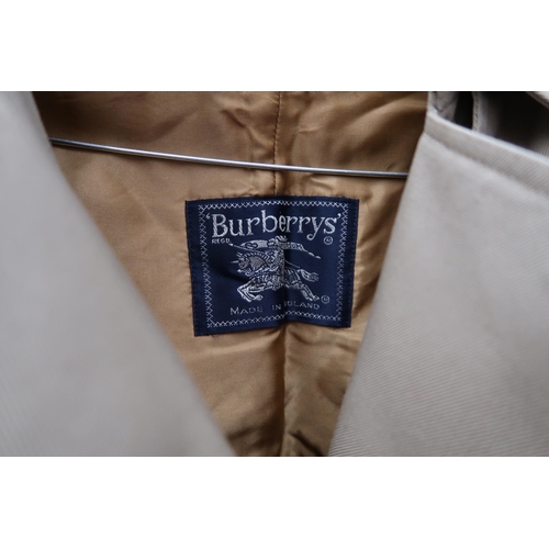 456 - A lady's Burberry double breasted rain or trench coat, size 12, complete with liner and scarf, and a... 