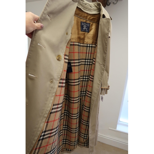 456 - A lady's Burberry double breasted rain or trench coat, size 12, complete with liner and scarf, and a... 