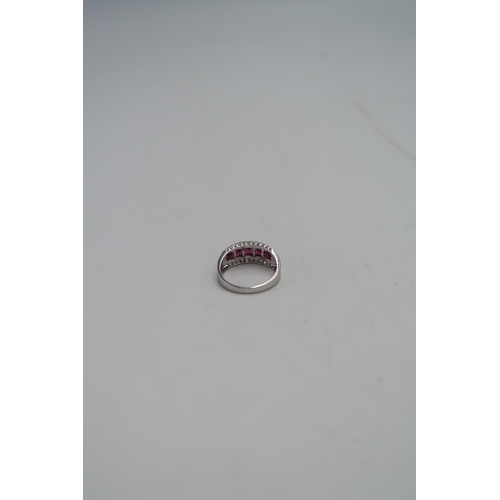 46 - A 9ct white gold dress ring set with five square cut red paste stones, flanked by small diamonds, si... 