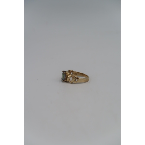 52 - A 9ct gold dress ring, with oval cut synthetic sapphire, marked 375, size S, 3.7g.