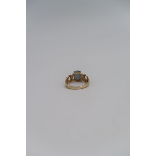 52 - A 9ct gold dress ring, with oval cut synthetic sapphire, marked 375, size S, 3.7g.