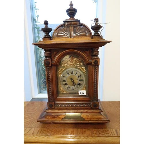 611 - A walnut cased late Victorian German striking mantle clock with brass dial and Roman numerals to cha... 