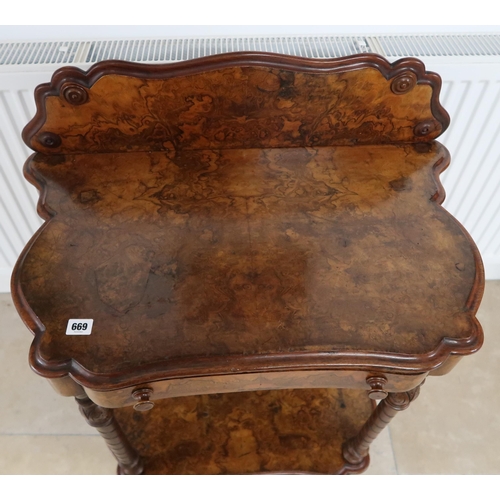 669 - A Victorian burr walnut, two tier side table, with frieze drawer having adjustable tooled leather wr... 