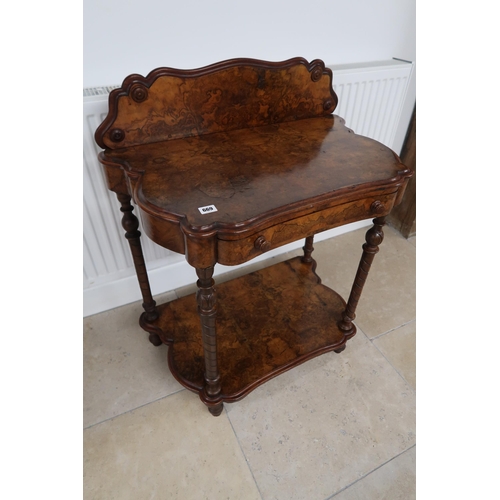 669 - A Victorian burr walnut, two tier side table, with frieze drawer having adjustable tooled leather wr... 