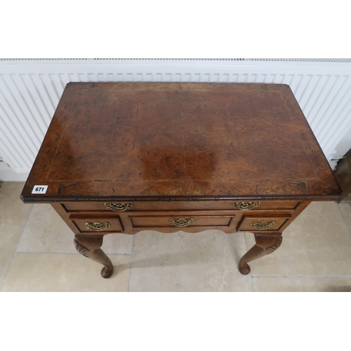 671 - A 20th century figured walnut four drawer lowboy, 75.5 by 45.5 by 78cm high.