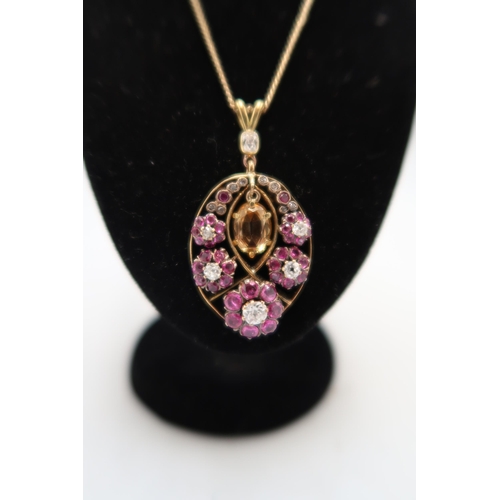 68A - A Victorian silver and gold old cut diamond and ruby cluster pendant, suspending a yellow oval topaz... 