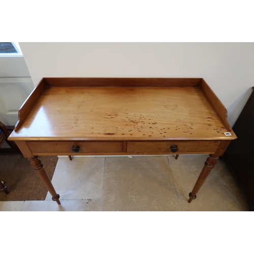 690 - A 19th century mahogany two drawer side table on turned legs - sturdy but usage marks to the top - W... 