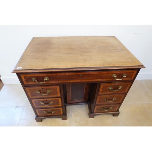 693 - A 19th century mahogany desk with seven drawers and a central cupboard door - Width 100cm x Depth 63... 