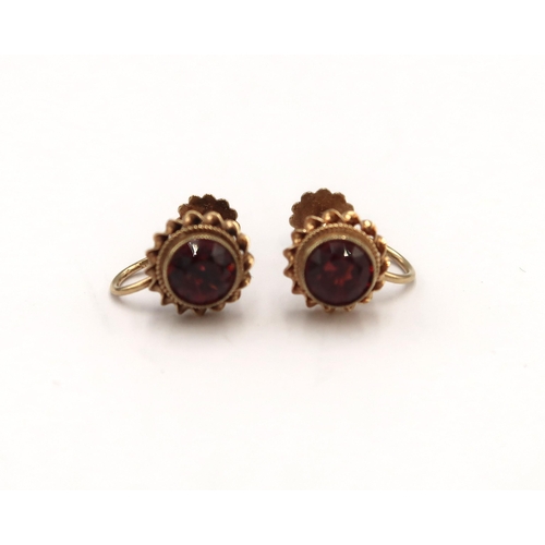 70 - A pair of 9ct hallmarked yellow gold and garnet earrings - approx weight 2.2 grams