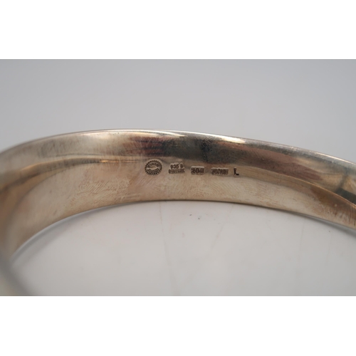 85 - Vivianna Torun Bulow-Hube for Georg Jensen: a Mobius ring silver bangle, number 206, fully signed an... 