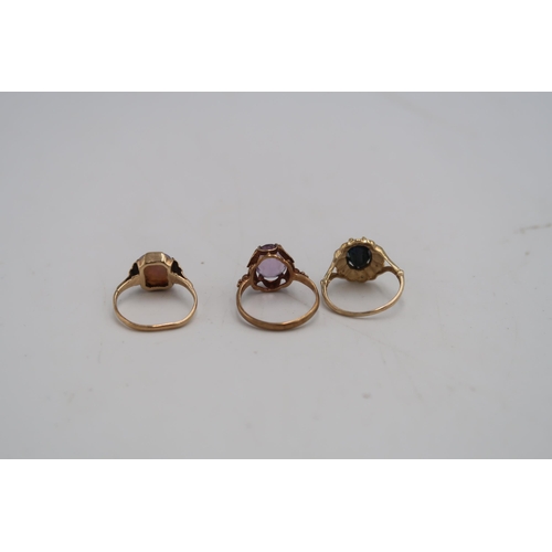 87 - Three 9ct H.M. yellow gold rings, one with sapphire to shoulder, one with amethyst and one with opal... 