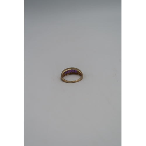 91 - A 9ct gold five stone ring, the emerald cut stones in a channel setting, size T, marked .375, 4.0g.