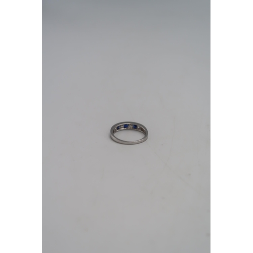 95 - A 14ct white gold and sapphire three stone ring, size U, hallmarked, 3.5g.