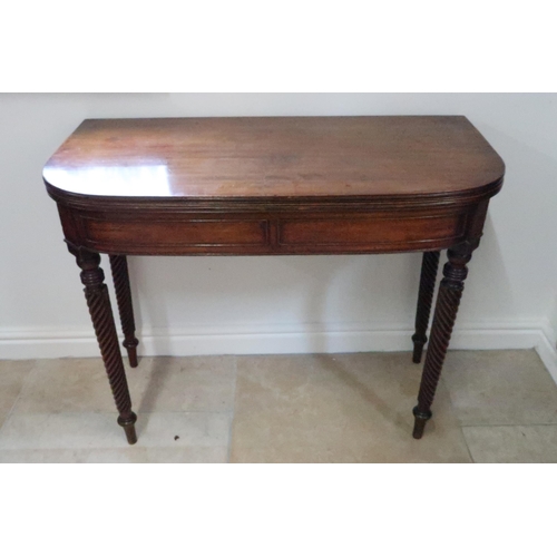 701 - A mahogany Georgian tea table turn over top with gateleg action, with turned twist column legs, 91cm... 