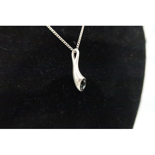 245A - A Georg Jensen Carnival pendant with Onyx - pendant drop 23mm - chain length 46cm - abrasions to bot... 