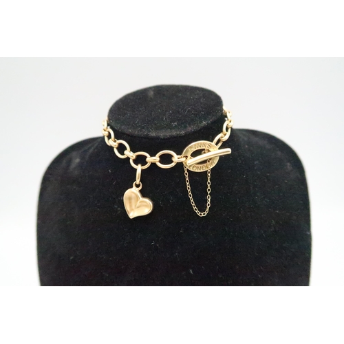 1 - LINKS OF LONDON - An 18ct gold ladies charm bracelet with heart charm - approx length 19cm - approx ... 