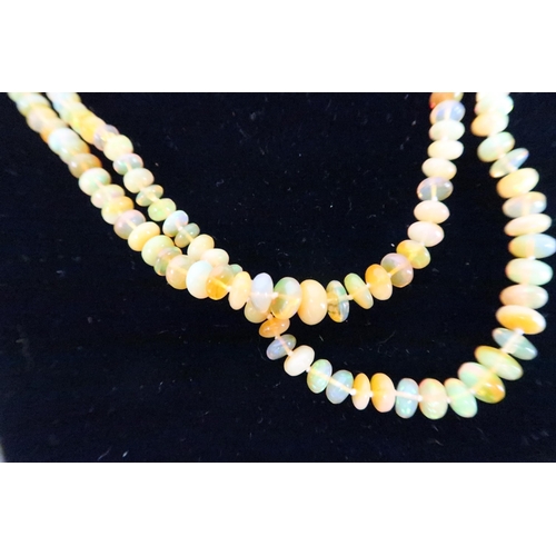 17 - An opal beaded double strand necklace, with 18ct gold and diamond five stone clasp, total length 45c... 