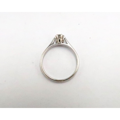 24 - An 18ct white gold and diamond solitaire ring, diamond of approximately 0.25ct, ring size R/S, 3.9g.