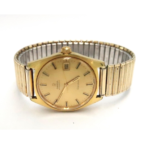 255 - A vintage Omega Automatic wristwatch, the gold coloured signed dial with baton markers, minute track... 