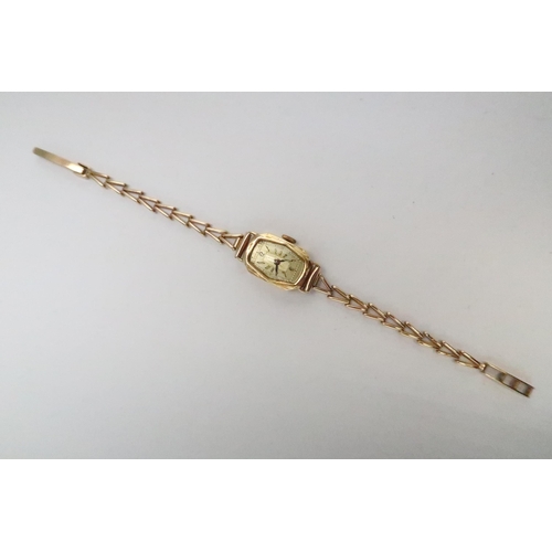 39 - A lady's 18ct gold cased cocktail watch with 9ct gold wishbone link strap, total weight including mo... 