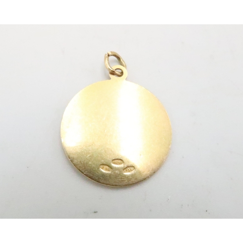 44 - An 18ct yellow gold medallion with suspension loop - weight approx 3.7 grams