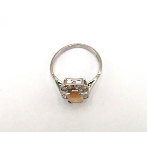 49 - A platinum and topaz and diamond dress ring size K - approx weight 3.5 grams