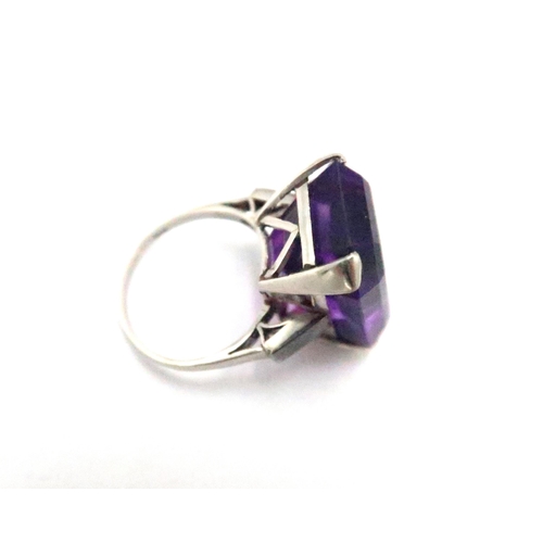 56 - A silver gilt large purple stone dress ring (possibly amethyst) - weight approx 11.5 grams