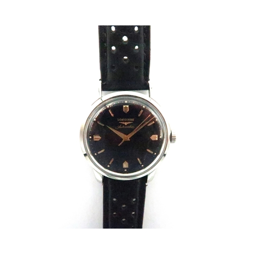 265 - A gents Longines Conquest automatic 1970's wristwatch - in working order - on a pierced leather stra... 