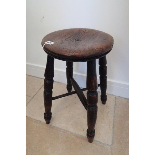 623 - A 19th century oak circular stool on turned supports with X stretcher