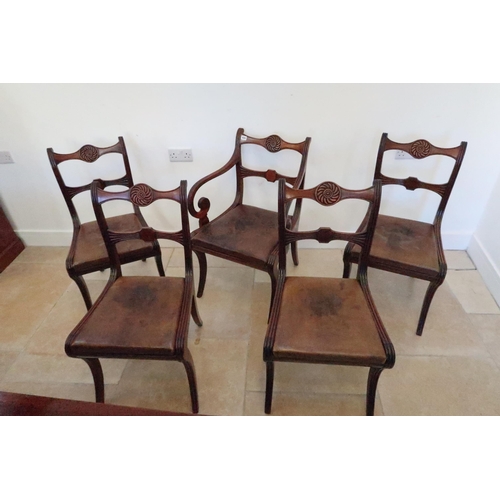 624 - Four 19th century mahogany dining chairs on sabre supports and a carver