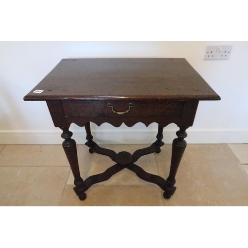 637 - An 18th century oak hall table with single drawer over shaped apron, turned supports joined by X str... 