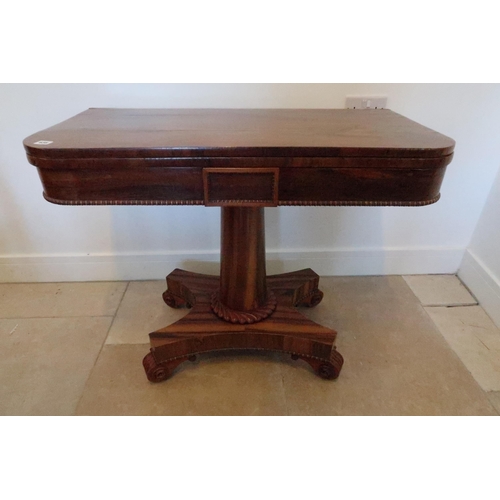 638 - A 19th century rosewood fold over card table