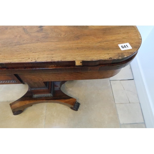 641 - A 19th century rosewood veneered card table, folding swivel top over single column support terminati... 