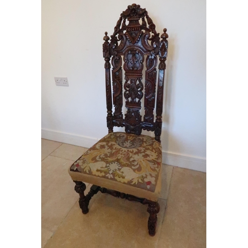 643 - A carved oak Carolean style hall chair, profusely carved with overstuffed seat raised on turned and ... 