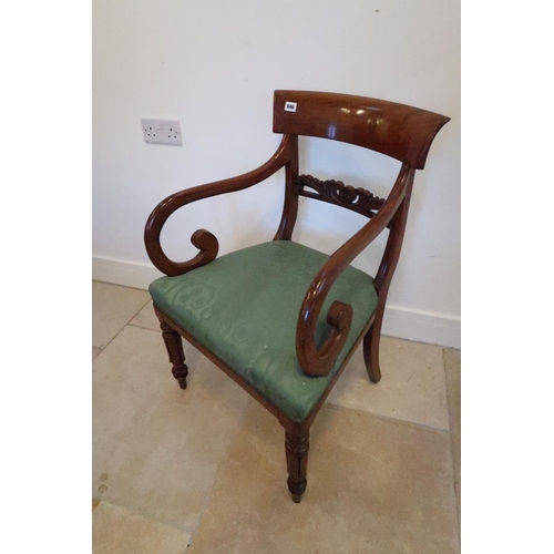 646 - A 19th century mahogany scroll arm desk chair