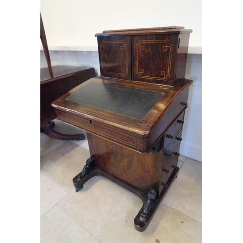 651 - A good 19th century rosewood davenport, the top with three drawers, four side drawers - sound condit... 