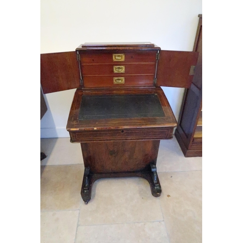 651 - A good 19th century rosewood davenport, the top with three drawers, four side drawers - sound condit... 