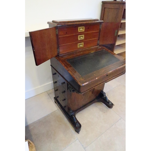 651 - A good 19th century rosewood davenport, the top with three drawers, four side drawers - sound condit... 