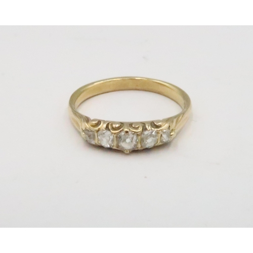 68 - An old cut diamond graduated five stone ring. Estimated 0.40ct. Size Q. Tests gold 18ct. Weight 3.37... 