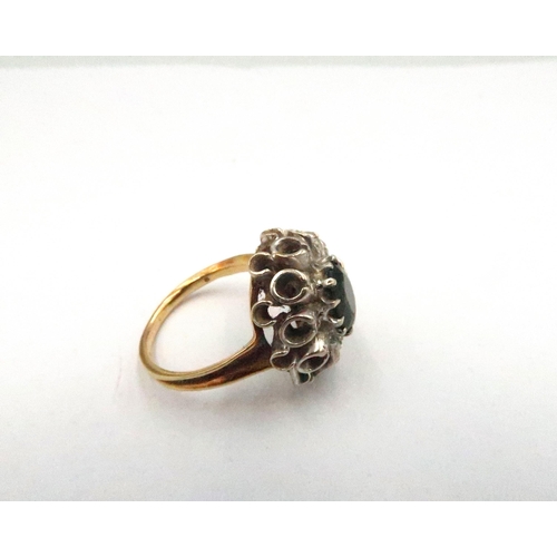 69 - An 18ct yellow gold dress ring, Irish stone and diamond - approx weight 9.4 grams - ring size T