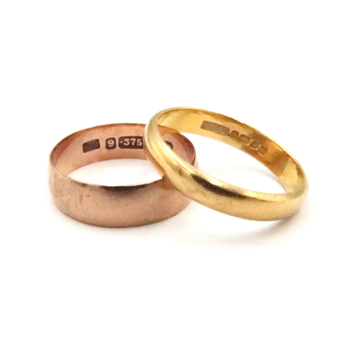 80 - A 22ct gold band ring. Size M. Weight 3.33 grams. Together with a 9ct band ring, size K 1/2. Weight ... 