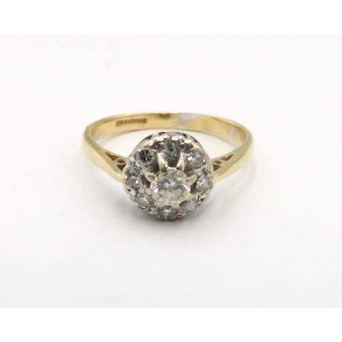 83 - An 18ct gold diamond cluster ring. Principal brilliant cut diamond estimated 0.20ct. Size Q 1/2. Wei... 