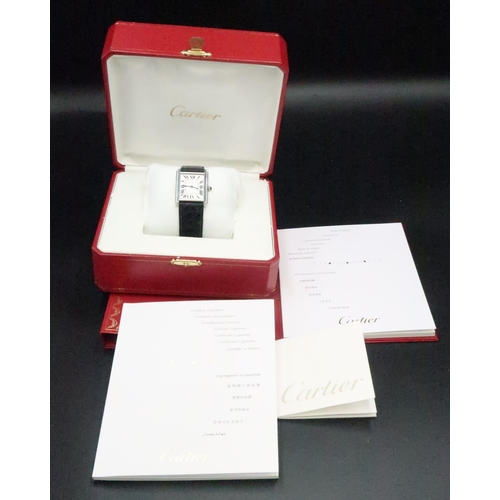 279 - A Cartier Stainless Steel Rectangular Wristwatch, model: Tank Solo, purchased in December 2009, quar... 