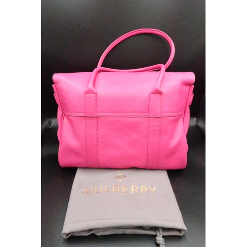 450 - A Mulberry Bayswater handbag, Fuscia pink with gold  coloured hardware - in brand new condition with... 