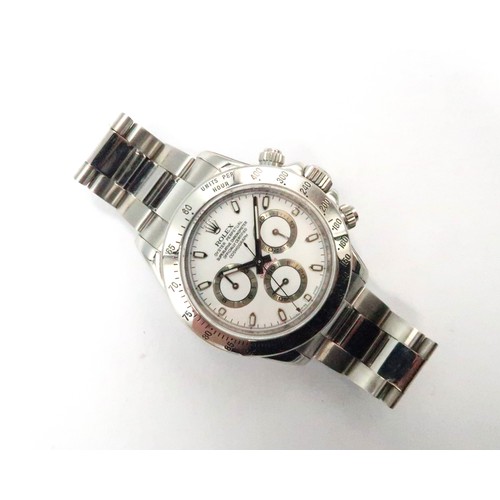 259 - A Rolex Daytona wristwatch - serial number 2 627 885 with box and papers dated 05/06/2007 and a serv... 