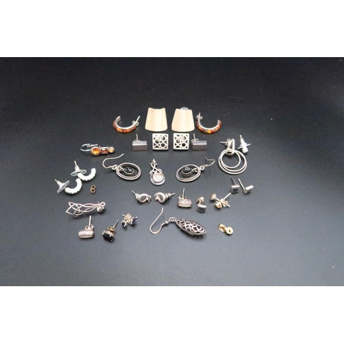 118 - A group of silver and gem set earrings, mostly pairs and a Celtic knot pendant set with a moonstone.