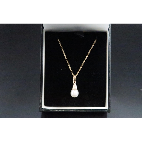 124 - A 9ct gold set pearl and diamond pendant, the pendant of teardrop form with pearl finial and three d... 