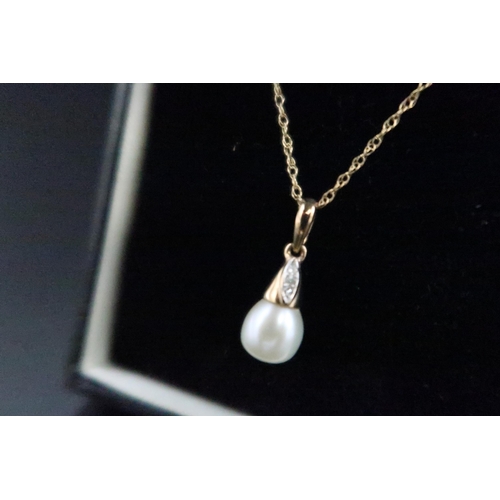 124 - A 9ct gold set pearl and diamond pendant, the pendant of teardrop form with pearl finial and three d... 