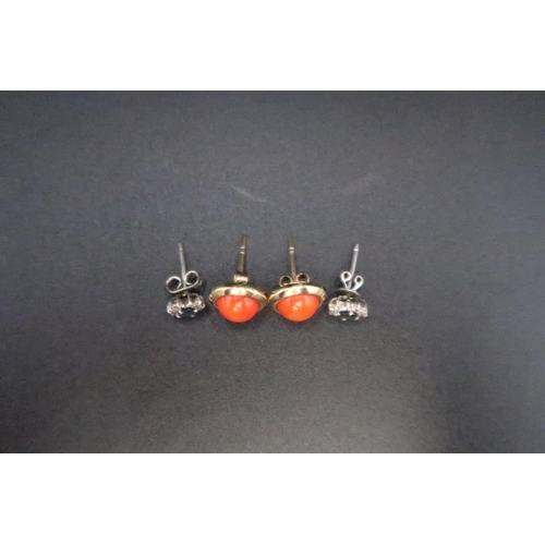 127 - A pair of gold and coral earrings, stems indistinctly marked but possibly 18ct, with 18ct gold butte... 